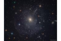 کهکشان بیضوی M59 و پوسته بیرونی آن